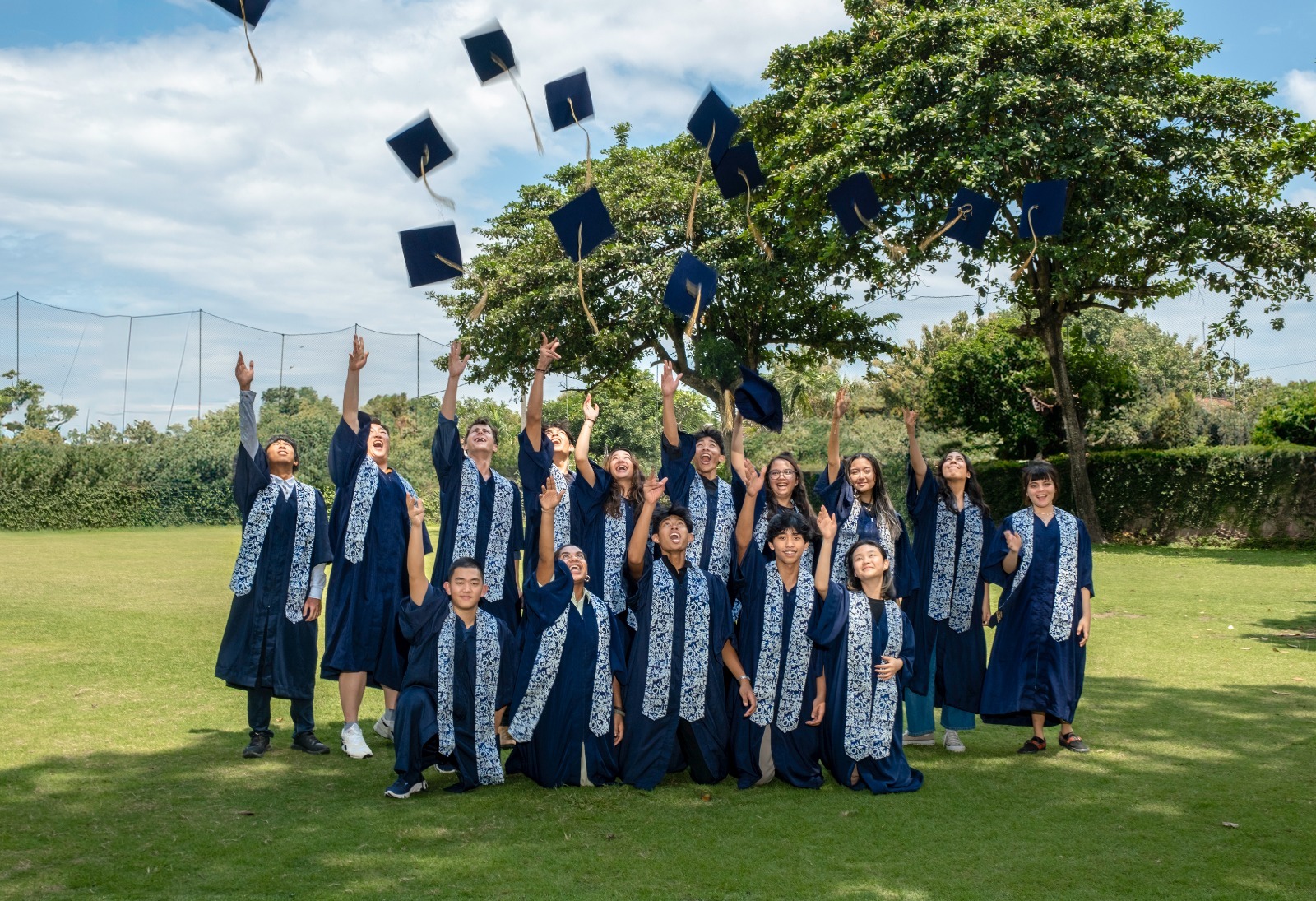 Our Grade 12 Students Throwing Their Graduation  Caps 